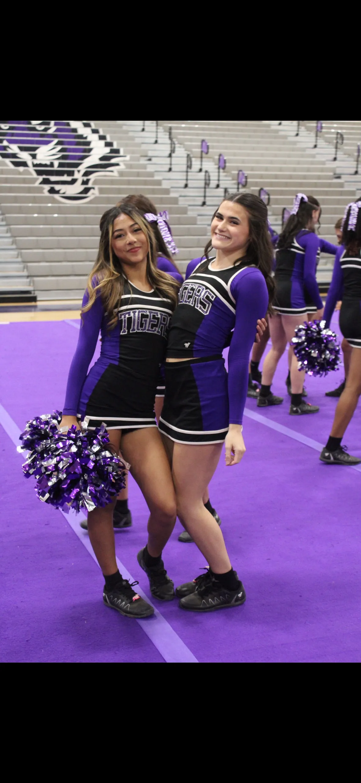 Millennium Tigers cheerleaders on the sideline at a football game