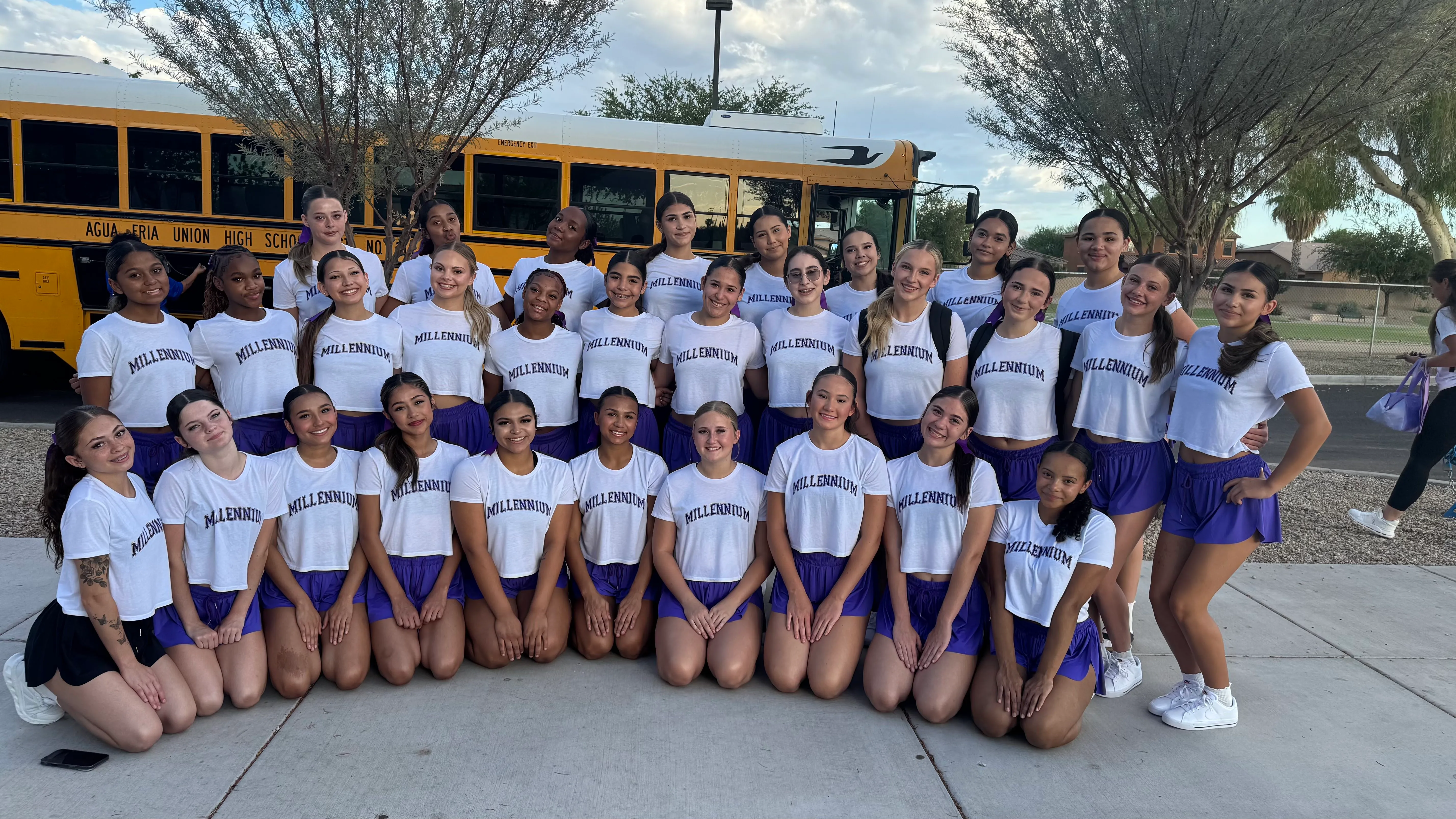 Millennium Tigers cheer team gathered by the bus before departing for TSC Summer Camp