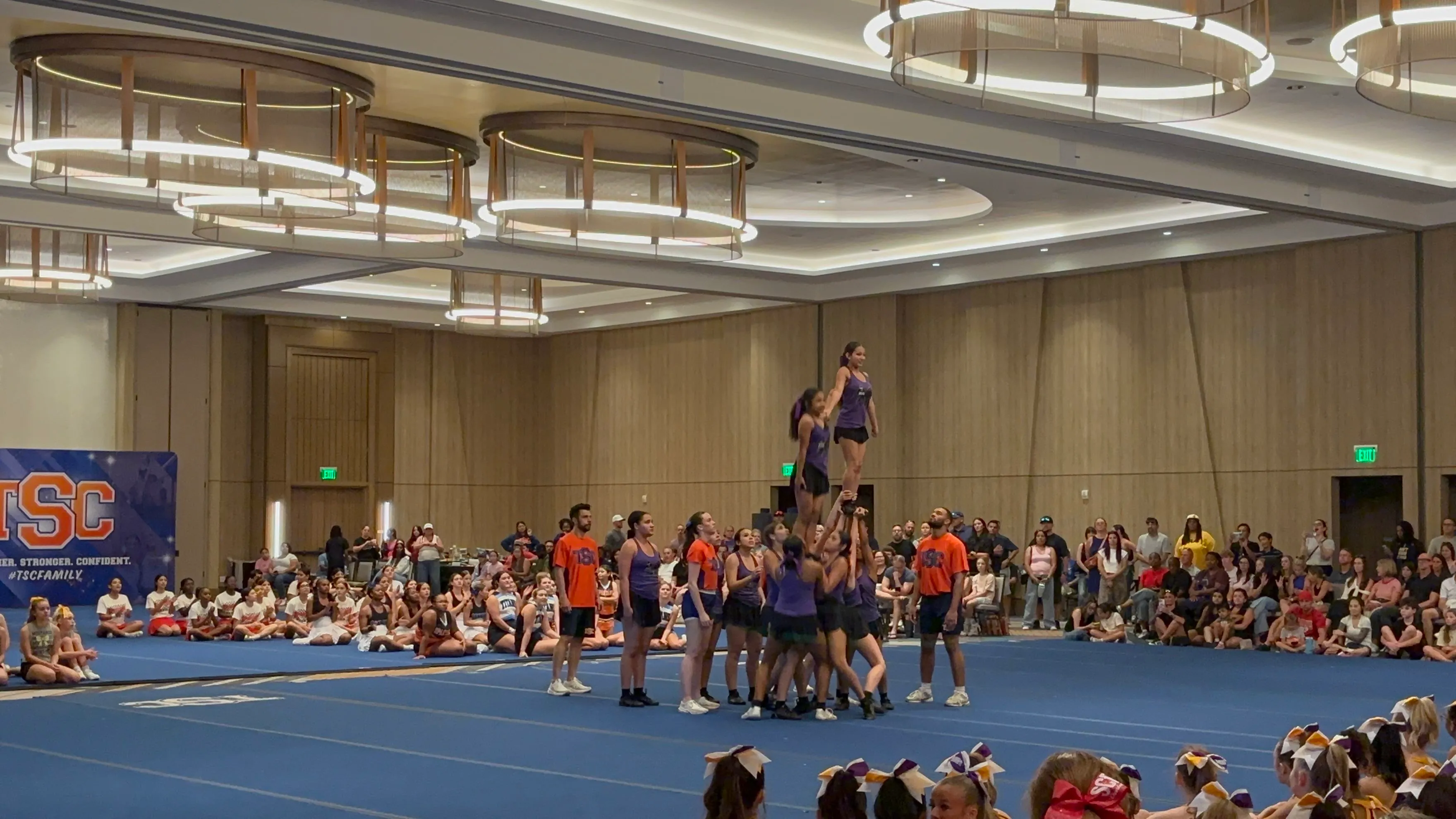 Millennium Tigers cheerleaders building a pyramid stunt at TSC Summer Camp